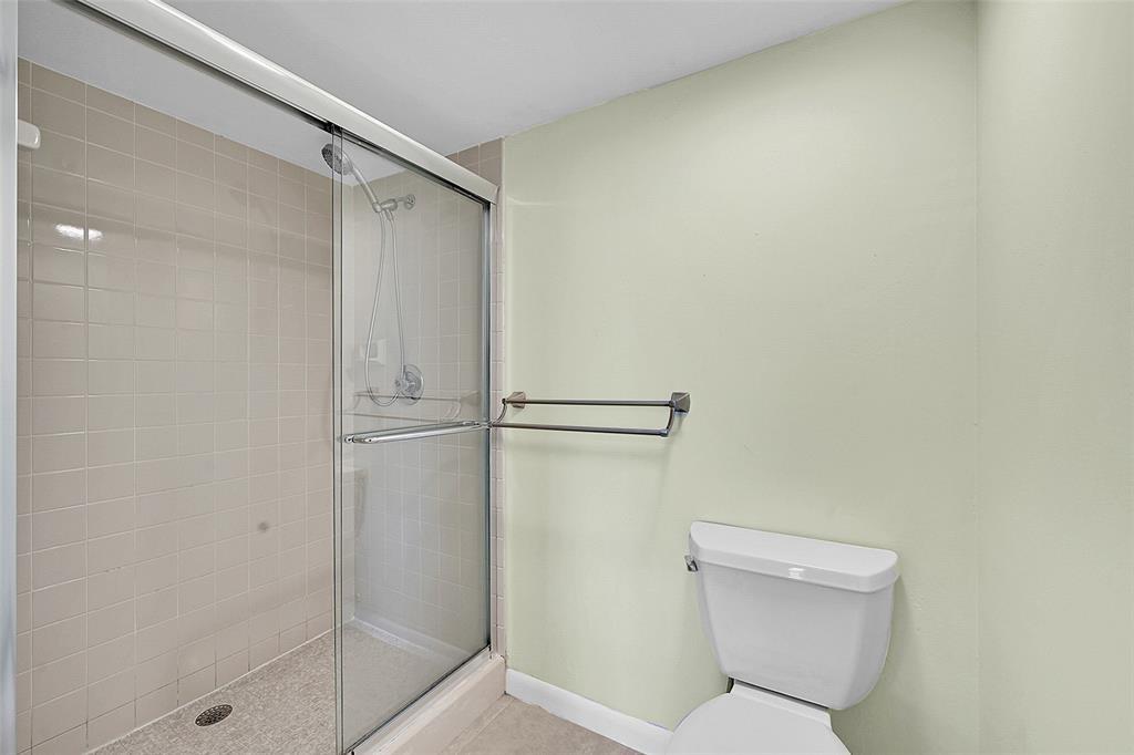 6109 Balboa Circle, Unit 305 Boca Raton, FL 33433 - Photo 21 of 22 a bathroom with a toilet and a shower