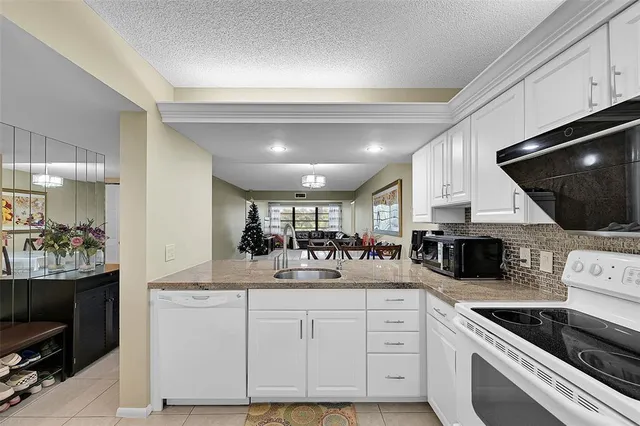 a kitchen with a sink and microwave