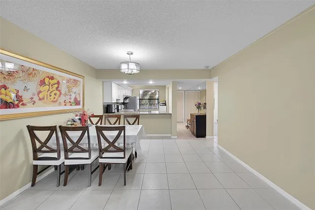 a view of a dining room with furniture and a livingroom