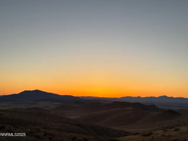 a view of an ocean and a mountain