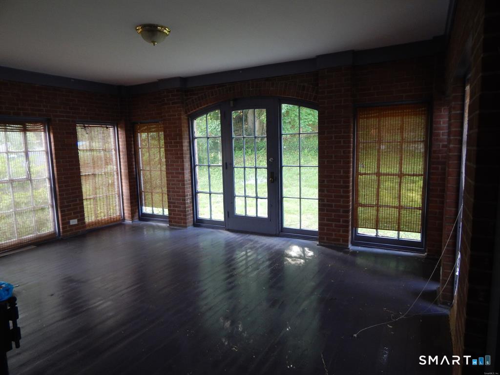 5 Clover Street Ansonia, CT 06401 - Photo 3 of 10 a view of a big room with wooden floor and windows