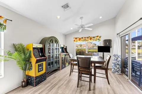 a view of a dining room with furniture window and wooden floor