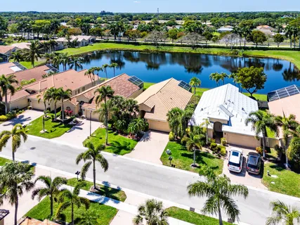 an aerial view of a house with a lake view