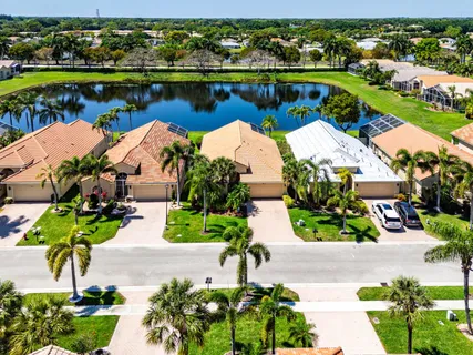 an aerial view of a house with a lake view