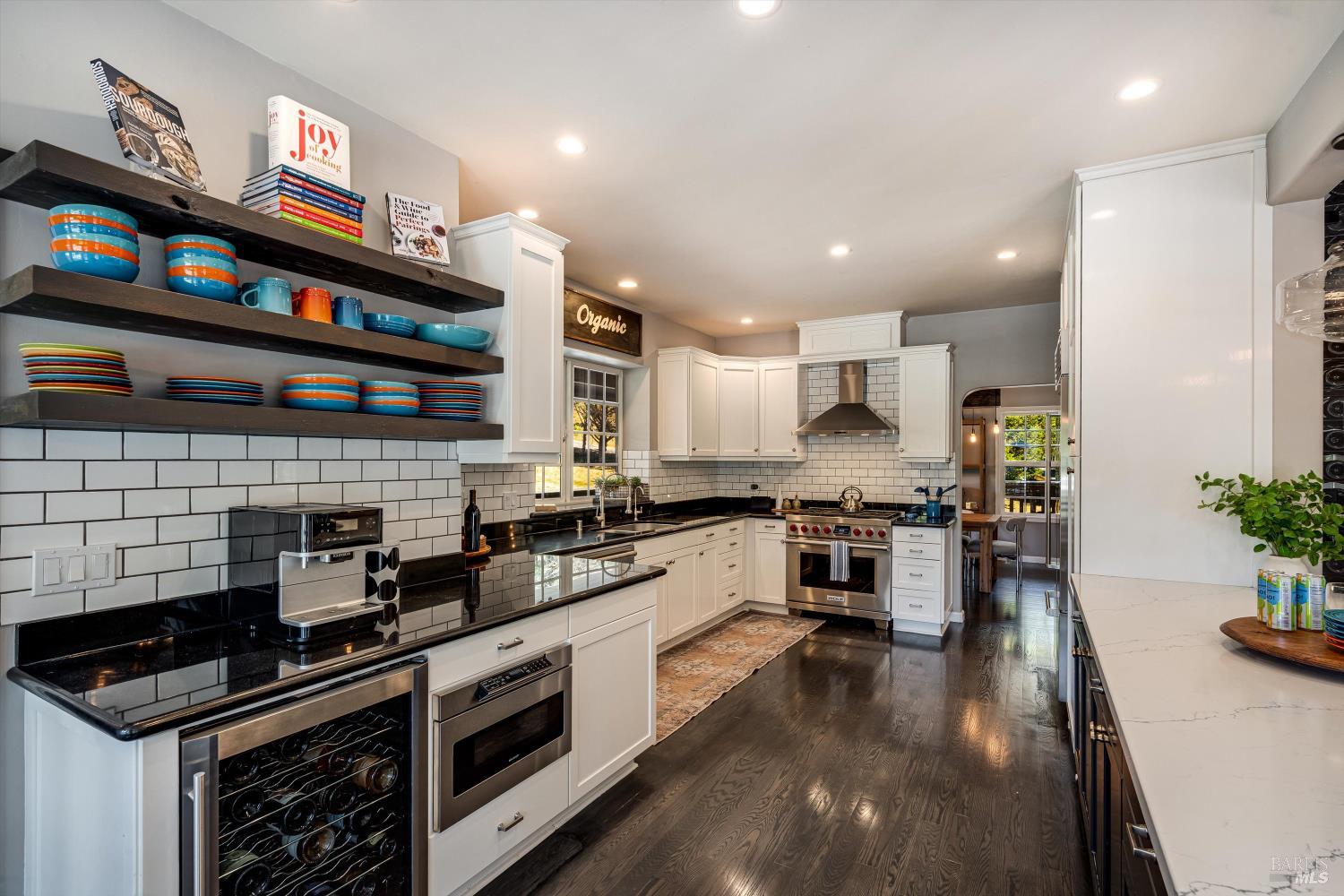 2980 Warm Springs Road Glen Ellen, CA 95442 - Photo 25 of 59 a kitchen with stainless steel appliances granite countertop wooden cabinets a stove a sink and a refrigerator