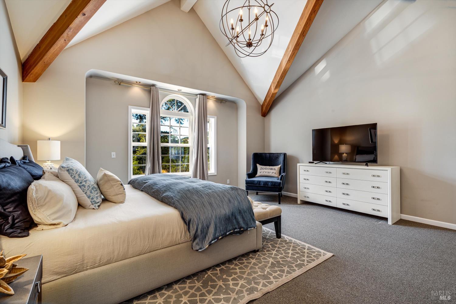 2980 Warm Springs Road Glen Ellen, CA 95442 - Photo 39 of 59 a bedroom with a large bed and a flat screen tv