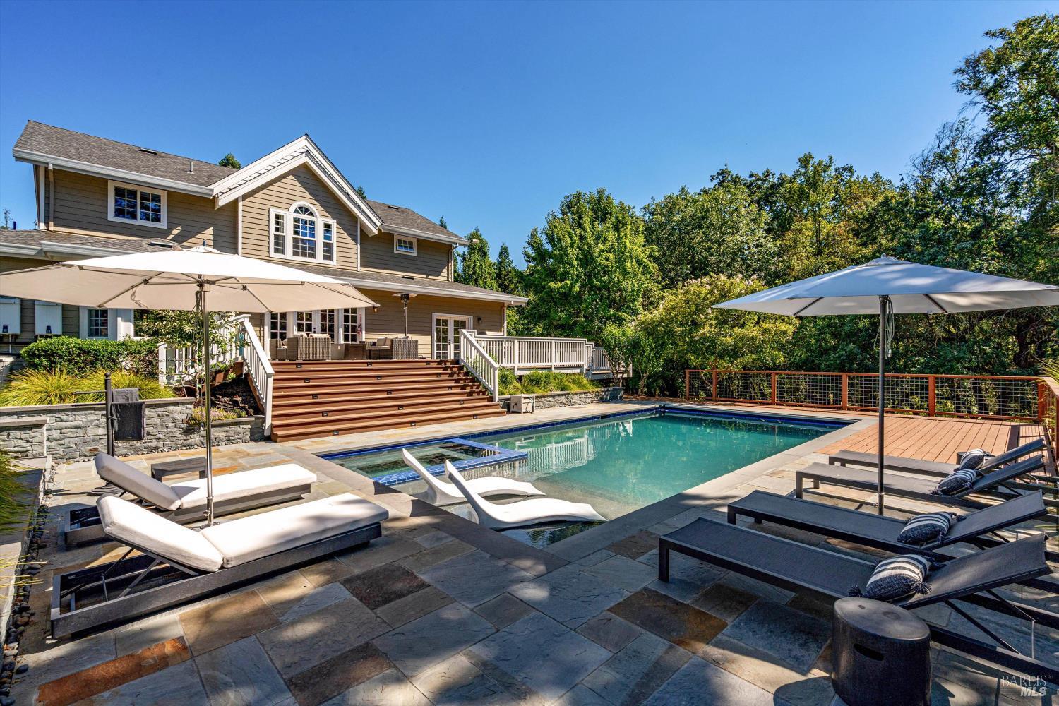 2980 Warm Springs Road Glen Ellen, CA 95442 - Photo 52 of 59 a view of a patio with a table and chairs under an umbrella