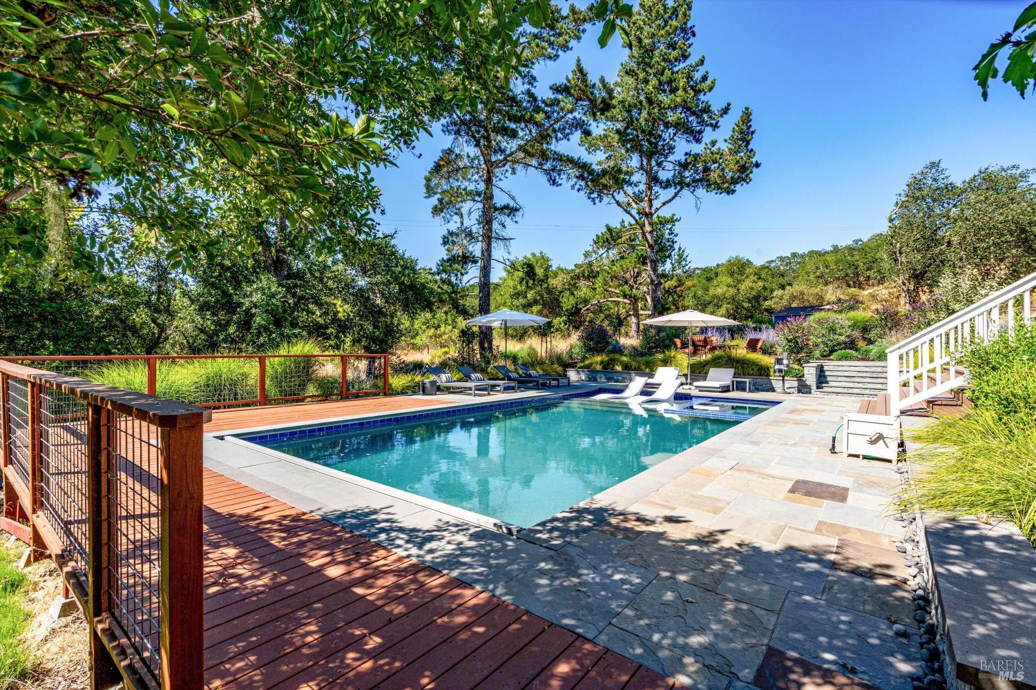 2980 Warm Springs Road Glen Ellen, CA 95442 - Photo 55 of 59 a view of a swimming pool with a bench and trees around