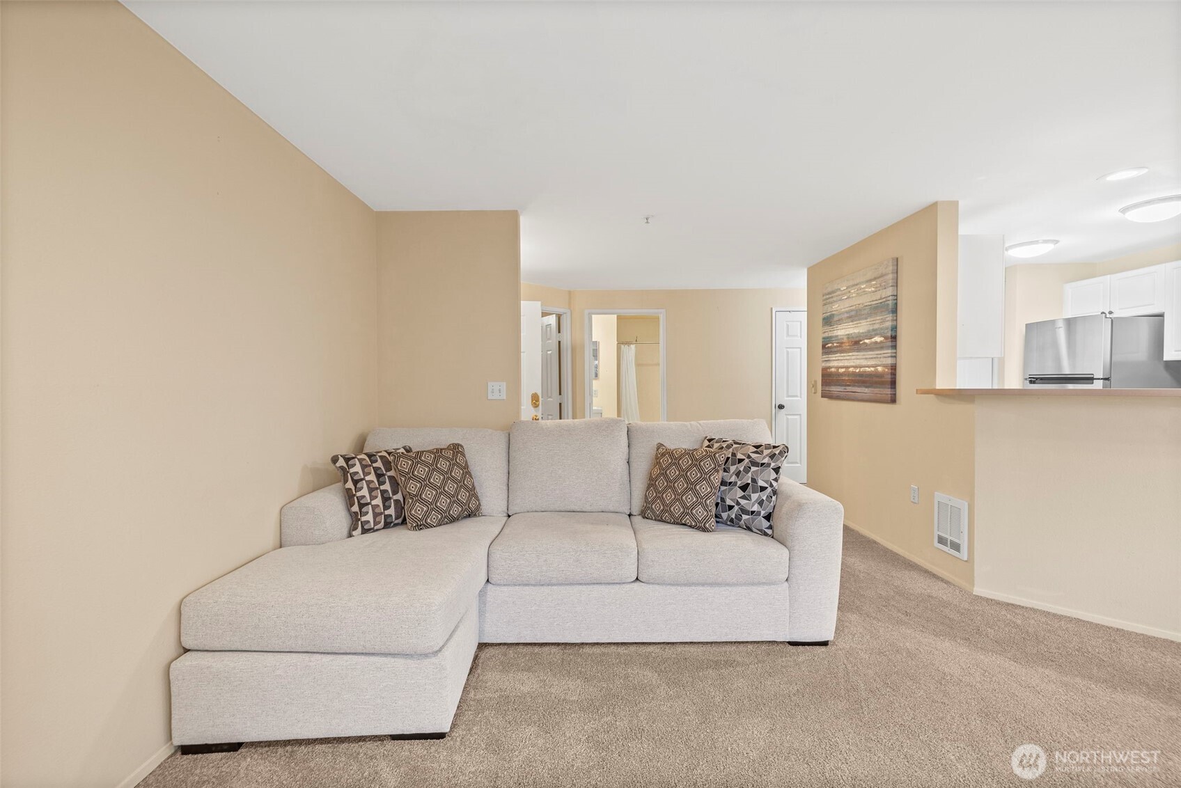 10824 Southeast 170th Street, Unit B103 Renton, WA 98055 - Photo 9 of 31 a living room with furniture and a couch
