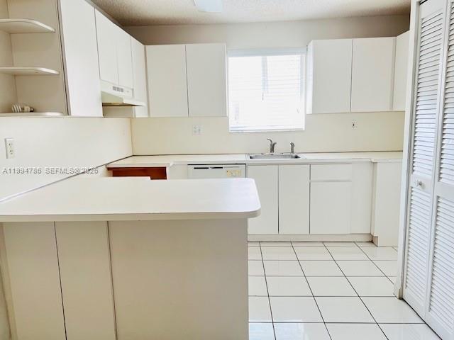 3260 West 70th Street, Unit 202 Hialeah, FL 33018 - Photo 3 of 20 a kitchen with a sink a stove and cabinets