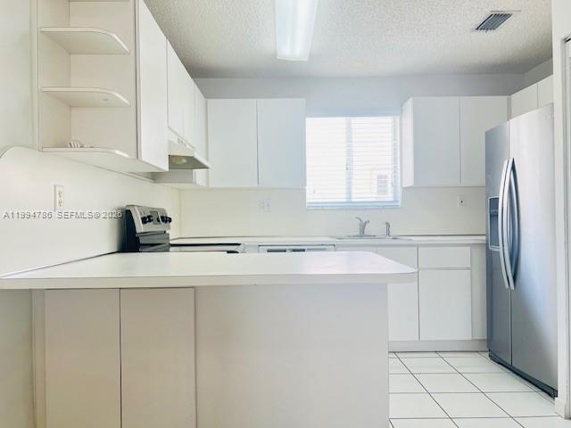 3260 West 70th Street, Unit 202 Hialeah, FL 33018 - Photo 6 of 20 a kitchen with appliances cabinets and a sink