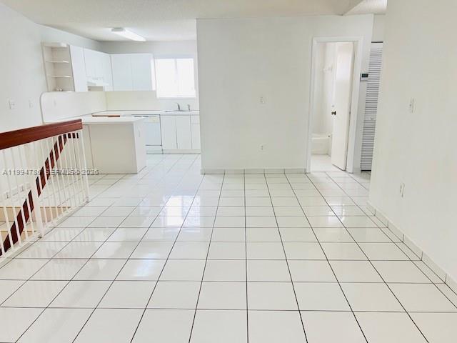 3260 West 70th Street, Unit 202 Hialeah, FL 33018 - Photo 9 of 20 a kitchen with a sink and cabinets