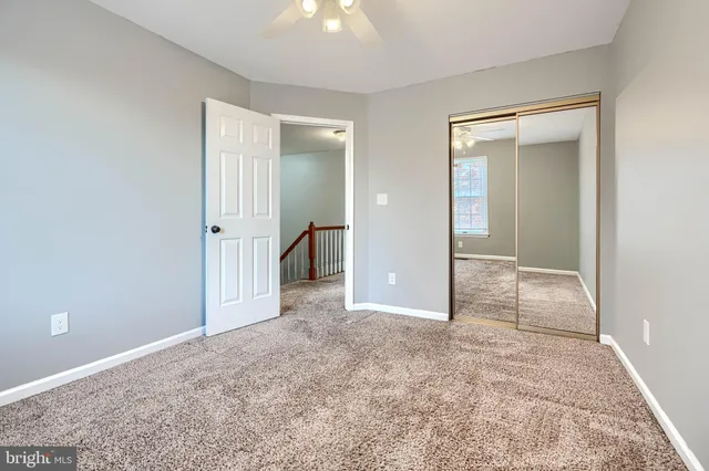 an empty room with closet area