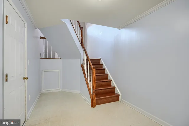 a view of an empty room with a fireplace