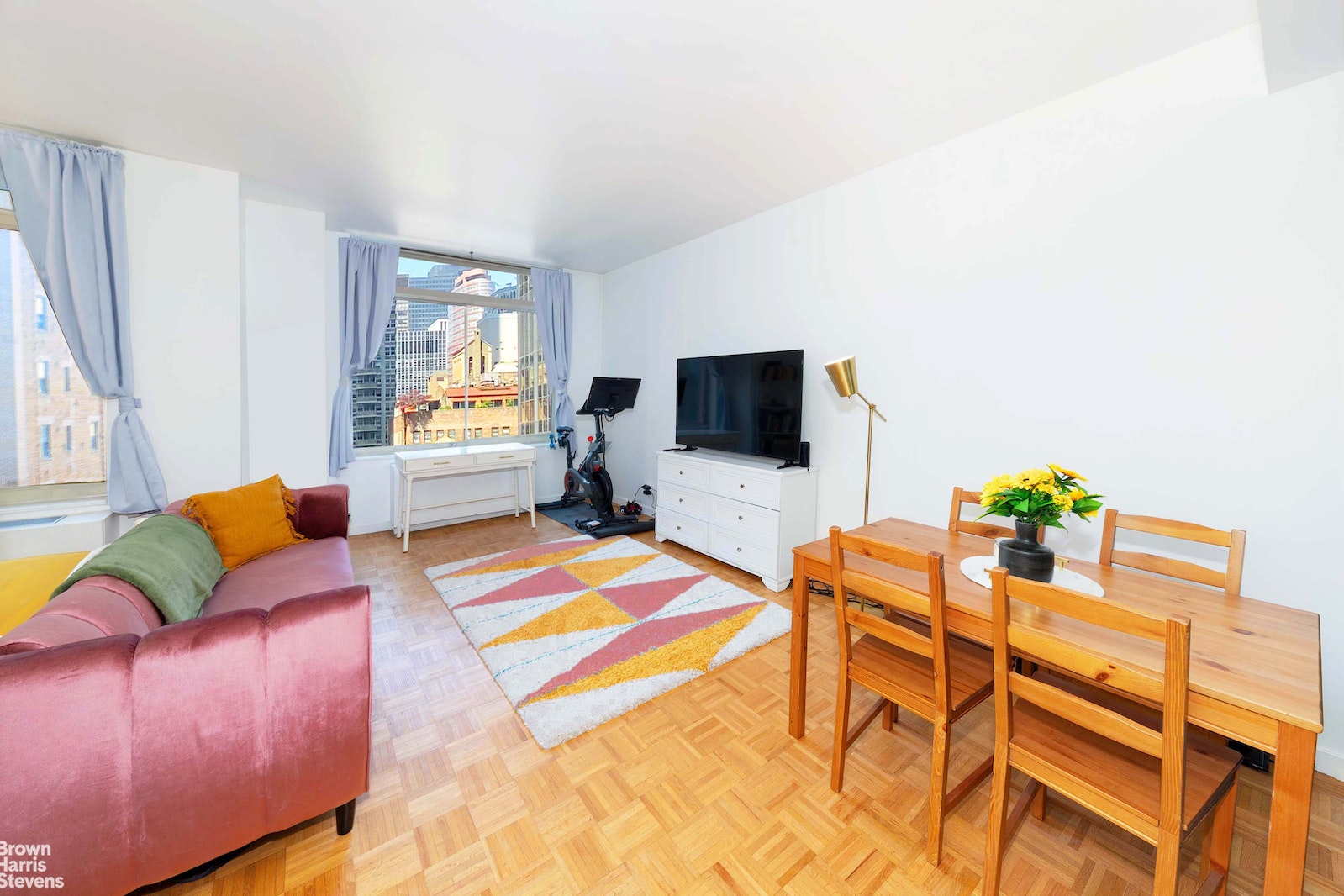 a living room with furniture and a flat screen tv