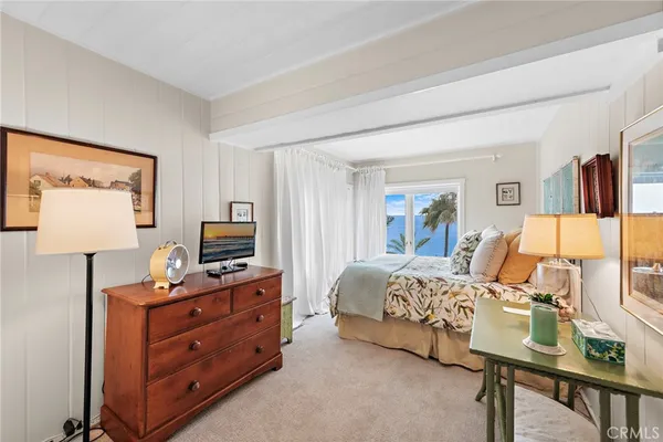 a bedroom with a bed and furniture