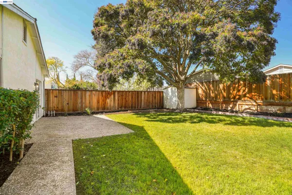 a living room with furniture a fireplace and a window