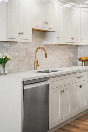a view of a tennis ground with large trees