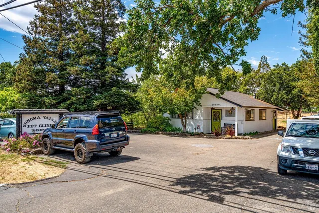 a view of a street with cars on road