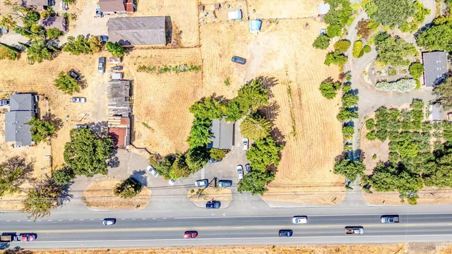 an view of a fountain with flower plants