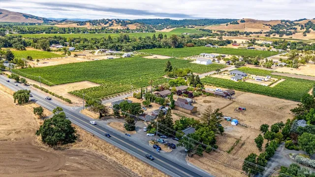 an aerial view of river residential houses with outdoor space and swimming pool