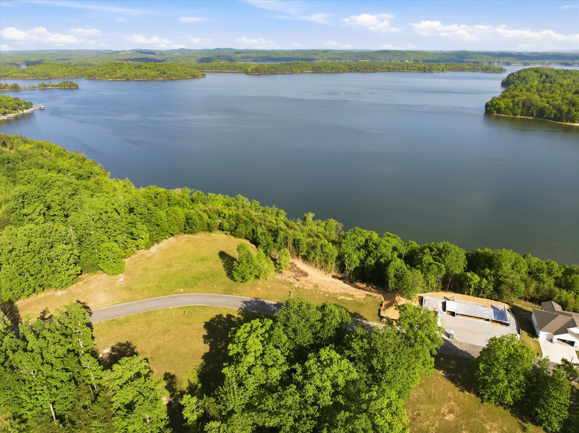 240 River Run Trail Spring City, TN 37381 - Photo 22 of 24 a view of a lake with a yard
