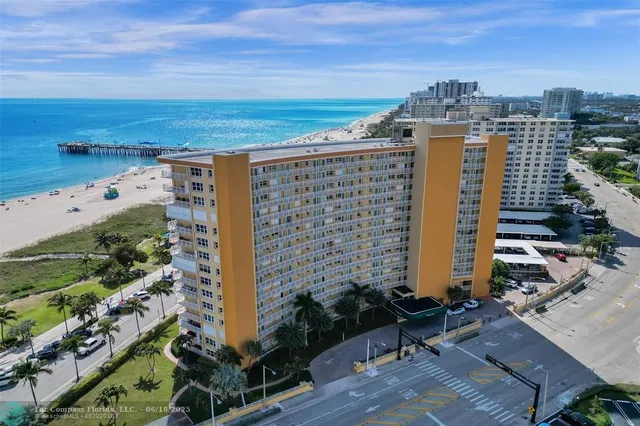 a living room with furniture and a view of dining room