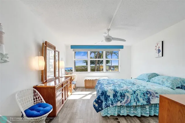 a bathroom with a sink shower and a mirror