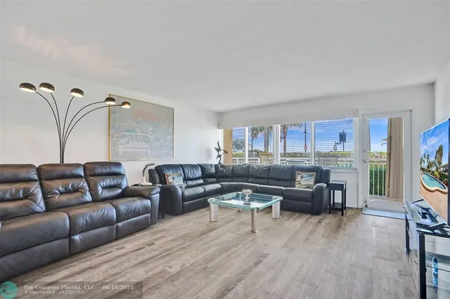a view of a chair and tables in the balcony