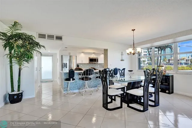 a kitchen with granite countertop a refrigerator and a sink