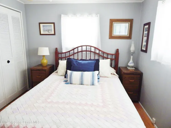 a bedroom with a bed and a table