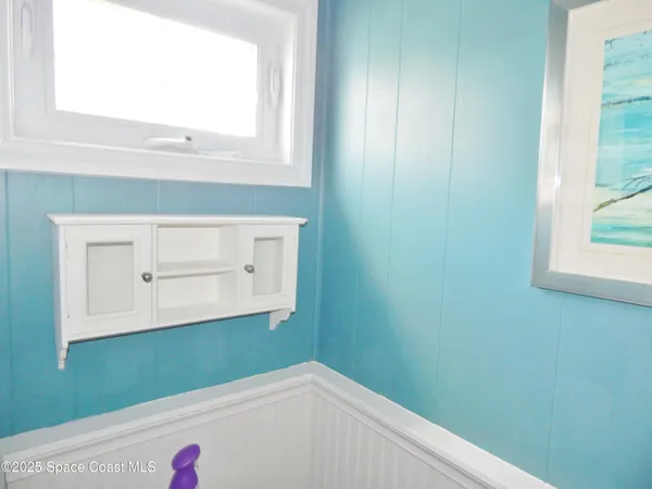a bathroom with a window vanity and a sink