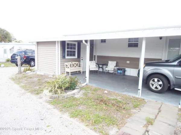 a view of living room filled with furniture and a table