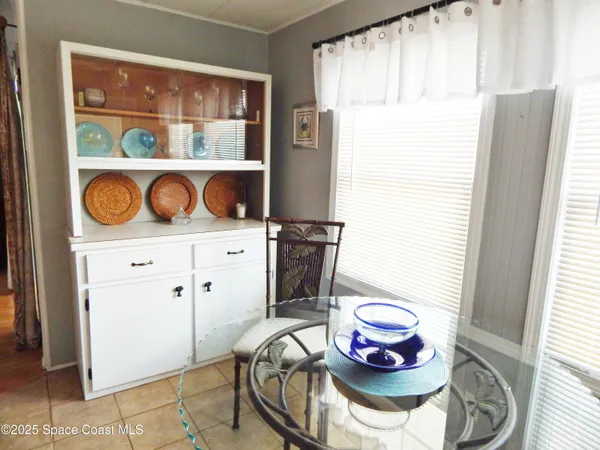 a table with a stove and a dining table