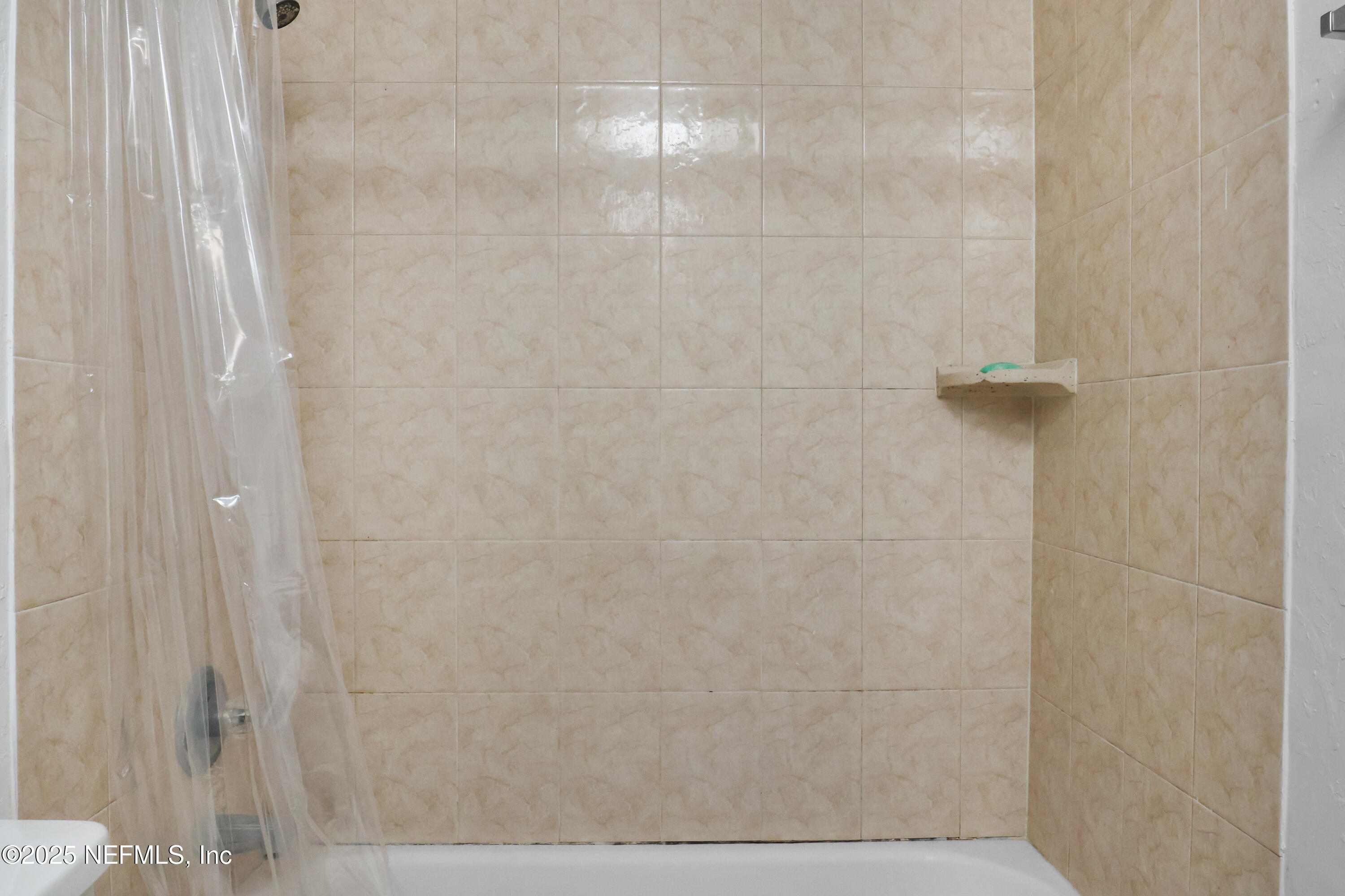 713 Southwest 69th Street, Unit A & B Gainesville, FL 32607 - Photo 14 of 21 a bathroom with a shower