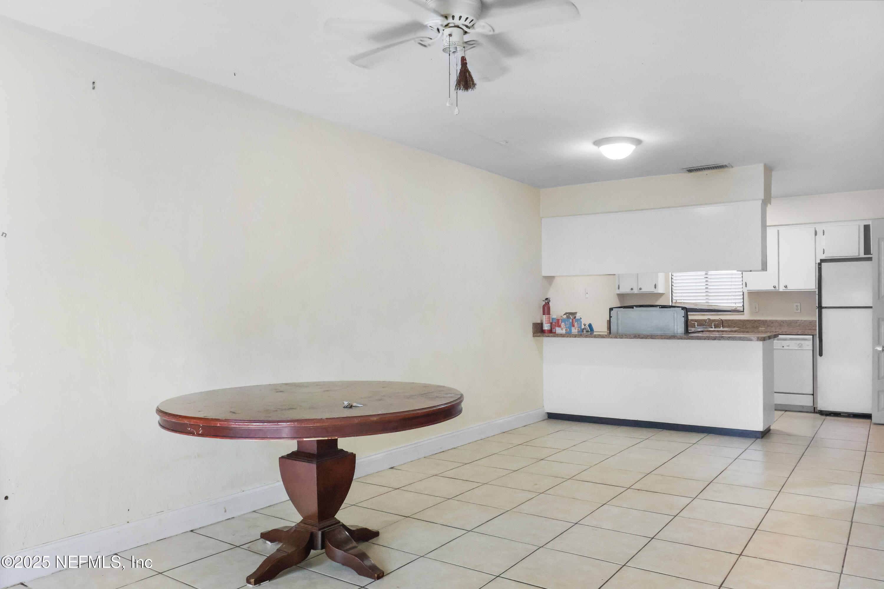 713 Southwest 69th Street, Unit A & B Gainesville, FL 32607 - Photo 2 of 21 a living room with a couch and a chandelier fan