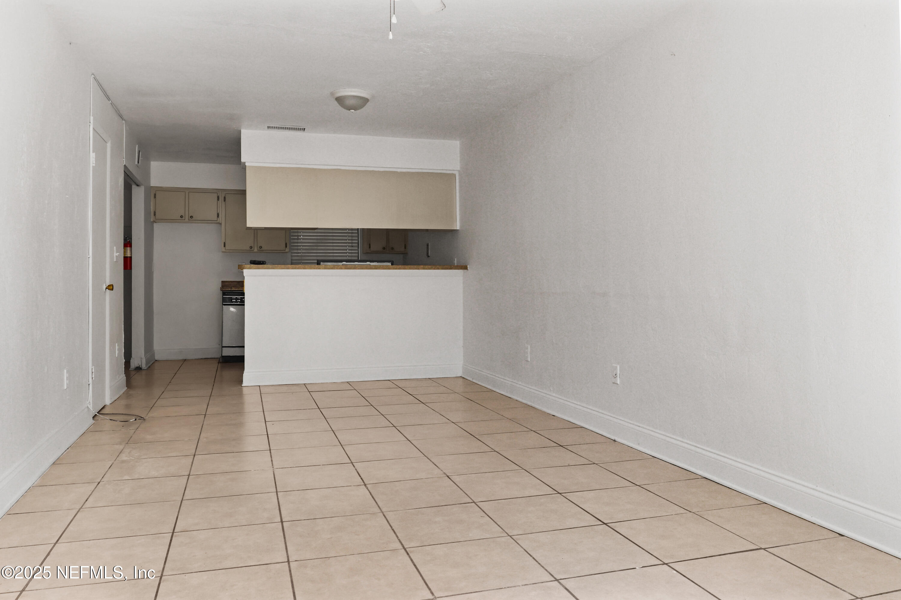 713 Southwest 69th Street, Unit A & B Gainesville, FL 32607 - Photo 10 of 21 a living room with a rug and white walls