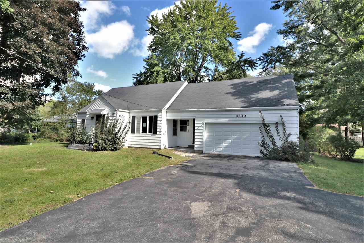 4330 Hononegah Road Roscoe, IL 61073 - Photo 1 of 25 a view of a house with a yard and large tree