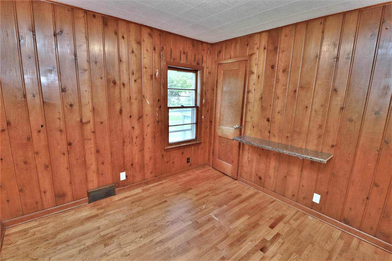 4330 Hononegah Road Roscoe, IL 61073 - Photo 14 of 25 a view of an empty room with wooden floor