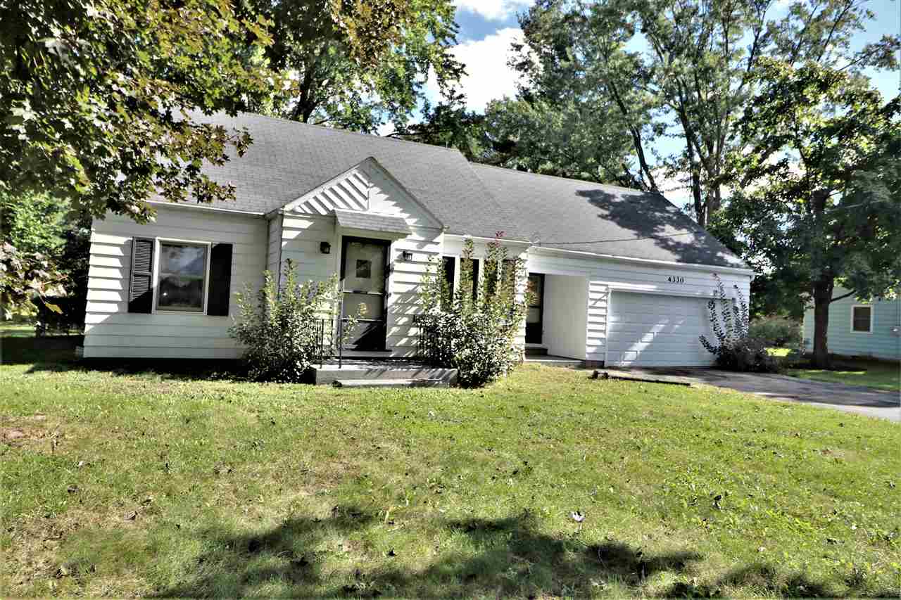4330 Hononegah Road Roscoe, IL 61073 - Photo 2 of 25 a front view of a house with a yard and garage
