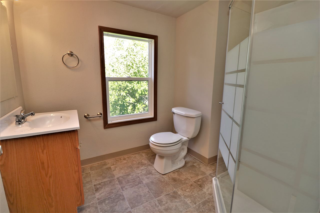 4330 Hononegah Road Roscoe, IL 61073 - Photo 21 of 25 a bathroom with a toilet sink and mirror