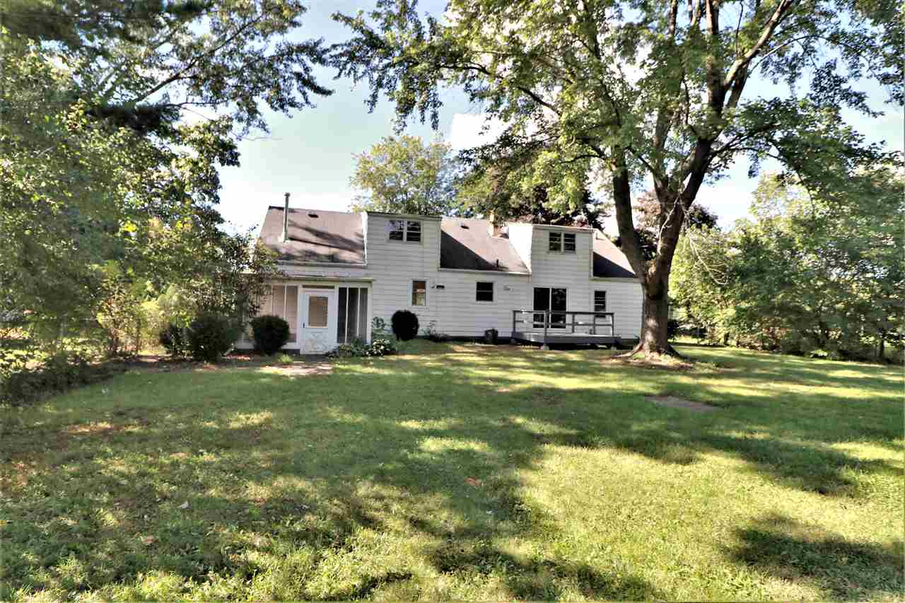 4330 Hononegah Road Roscoe, IL 61073 - Photo 25 of 25 a view of a house with a big yard and large trees