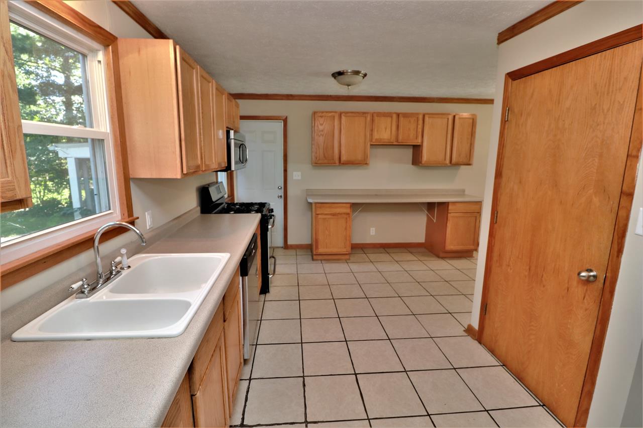 4330 Hononegah Road Roscoe, IL 61073 - Photo 8 of 25 a bathroom with a sink toilet and mirror