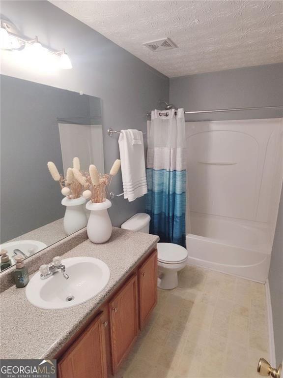 1600 Keystone Drive Conley, GA 30288 - Photo 11 of 12 a bathroom with a granite countertop sink toilet and shower