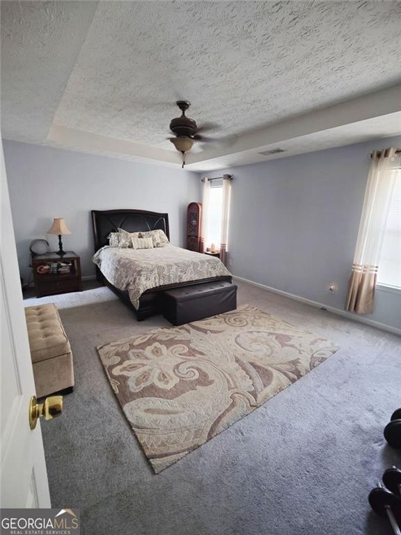 1600 Keystone Drive Conley, GA 30288 - Photo 6 of 12 a bedroom with a bed and a chair