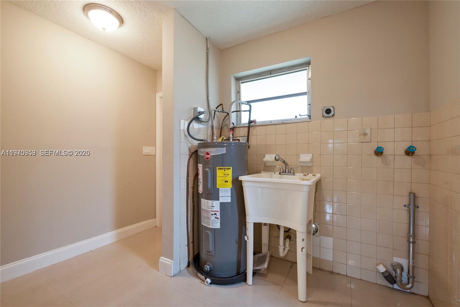 5632 Hayes Street Hollywood, FL 33021 - Photo 11 of 42 a bathroom with a sink and a mirror