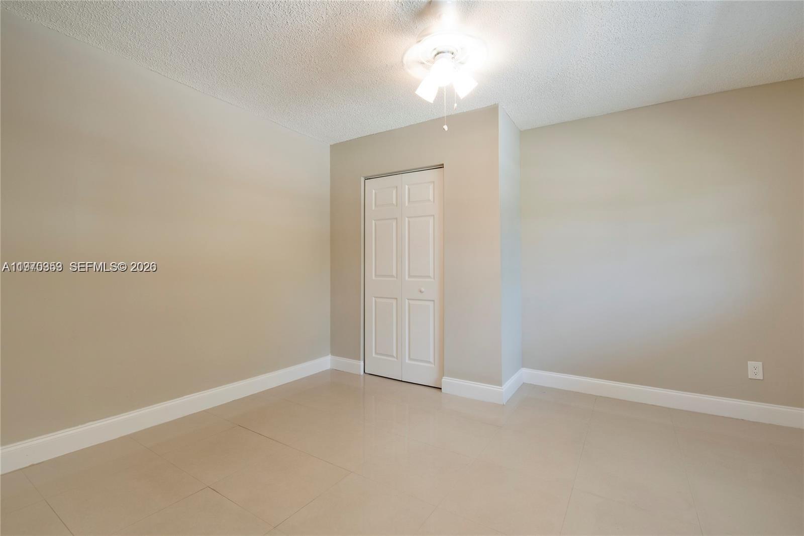 5632 Hayes Street Hollywood, FL 33021 - Photo 12 of 42 an empty room with a empty space and windows