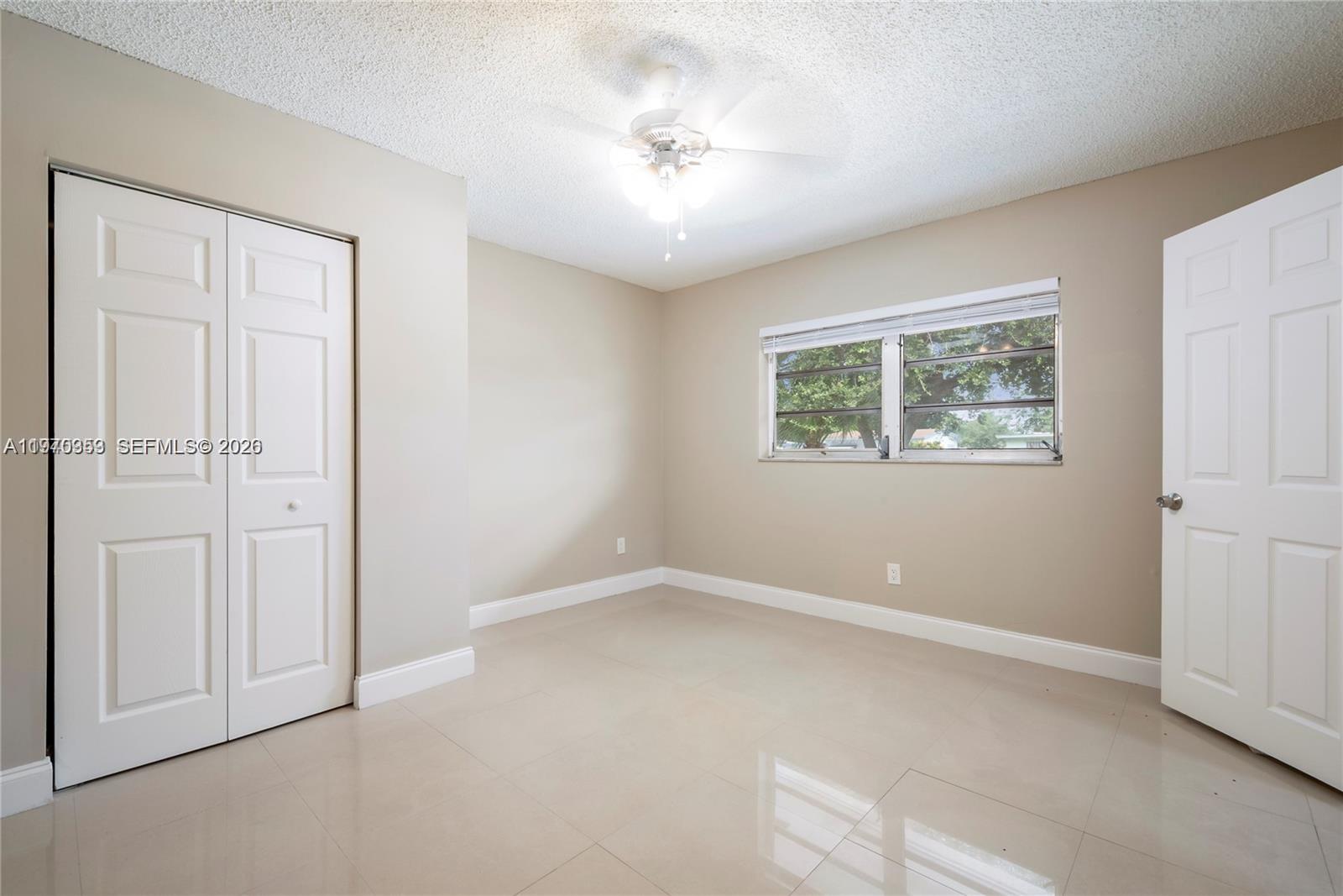 5632 Hayes Street Hollywood, FL 33021 - Photo 15 of 42 an empty room with windows and closet