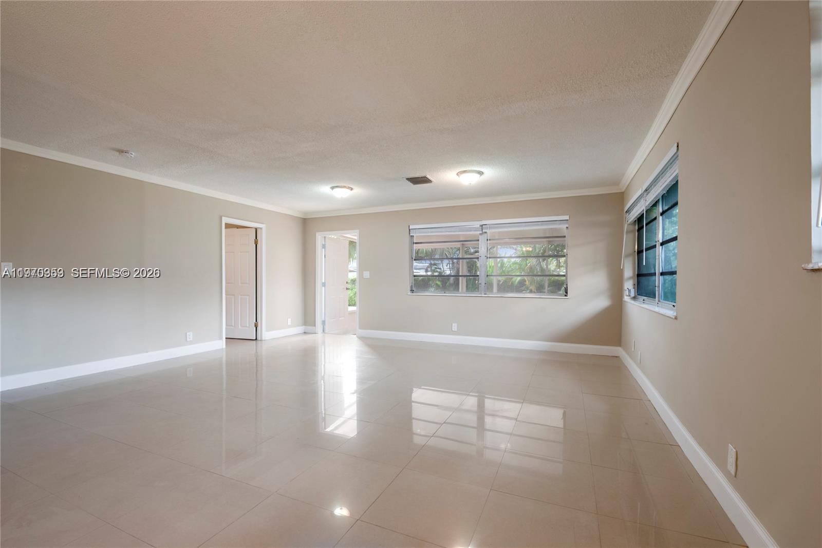 5632 Hayes Street Hollywood, FL 33021 - Photo 16 of 42 a view of an empty room with a window