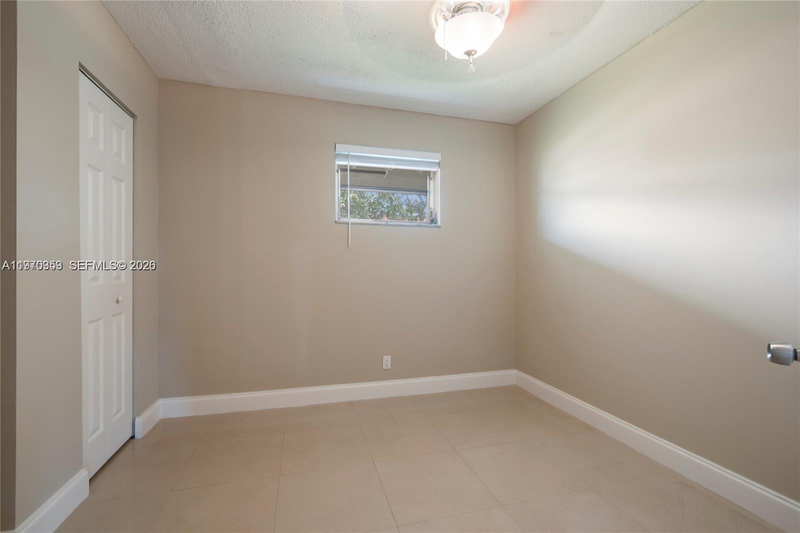 5632 Hayes Street Hollywood, FL 33021 - Photo 17 of 42 an empty room with a workbench